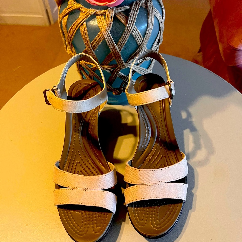 Cream colored wedge heels by Crocs